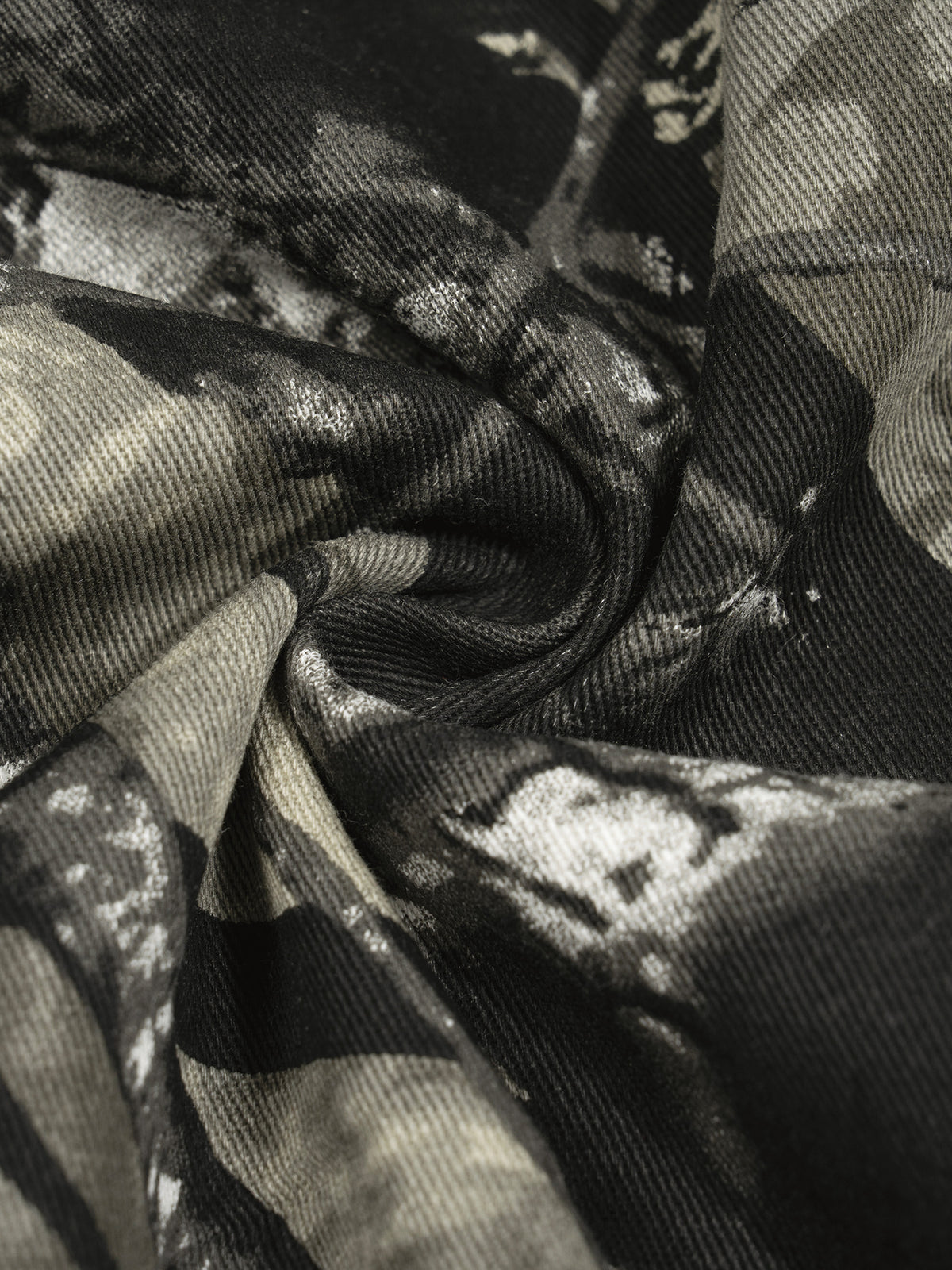 White and grey flame icon on Unisex Tree Camo Barrel Leg Pants